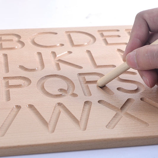 Schrijfplank om de letters te leren schrijven.